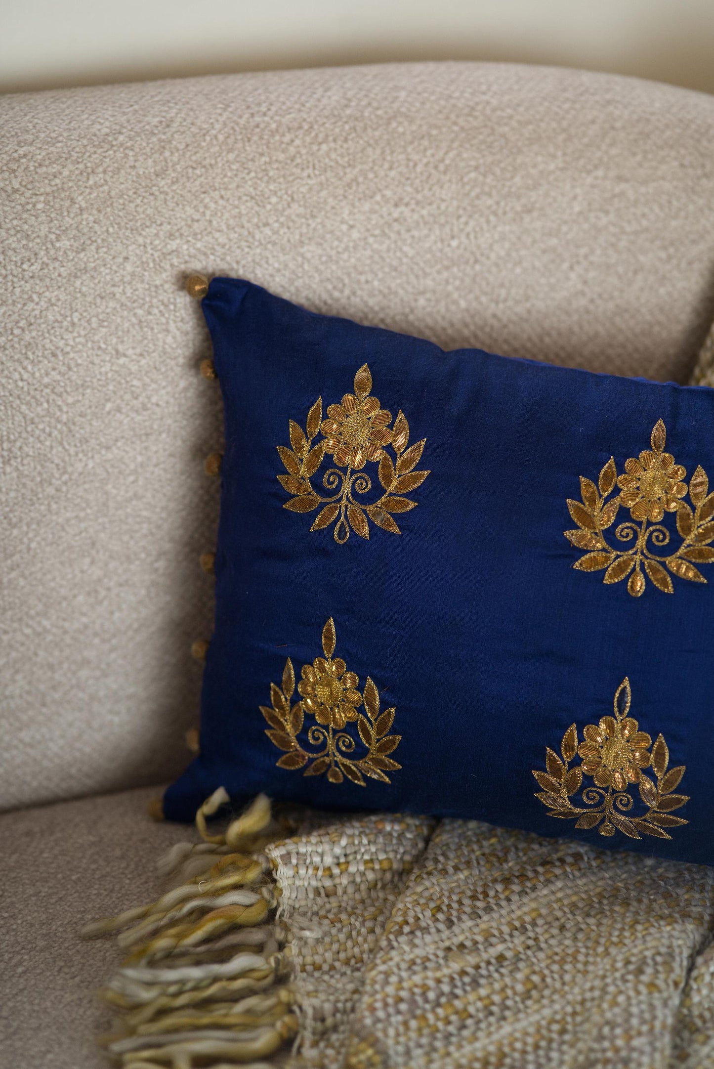 The blue embroidered cushion