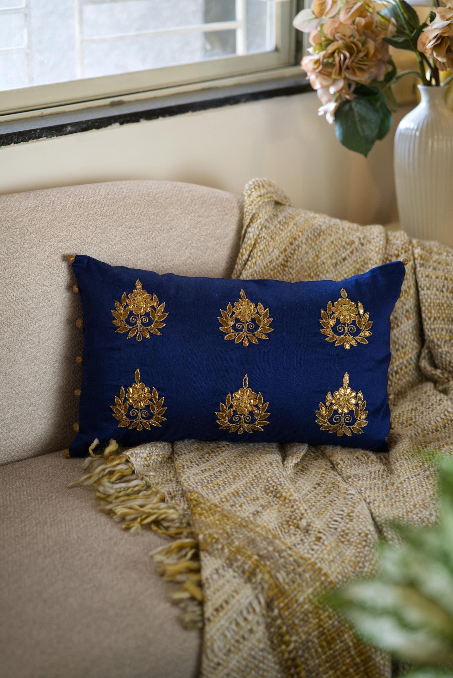 The blue embroidered cushion