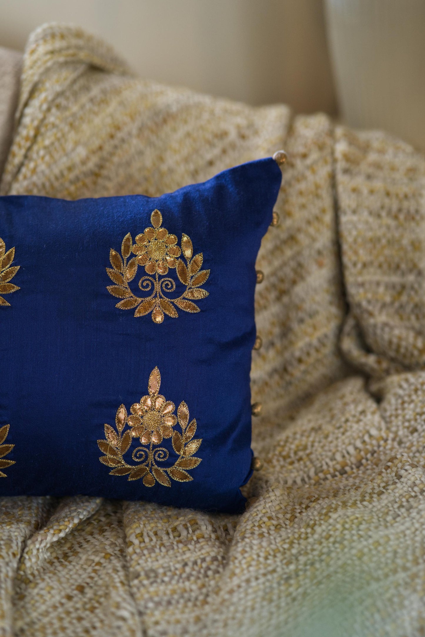 The blue embroidered cushion